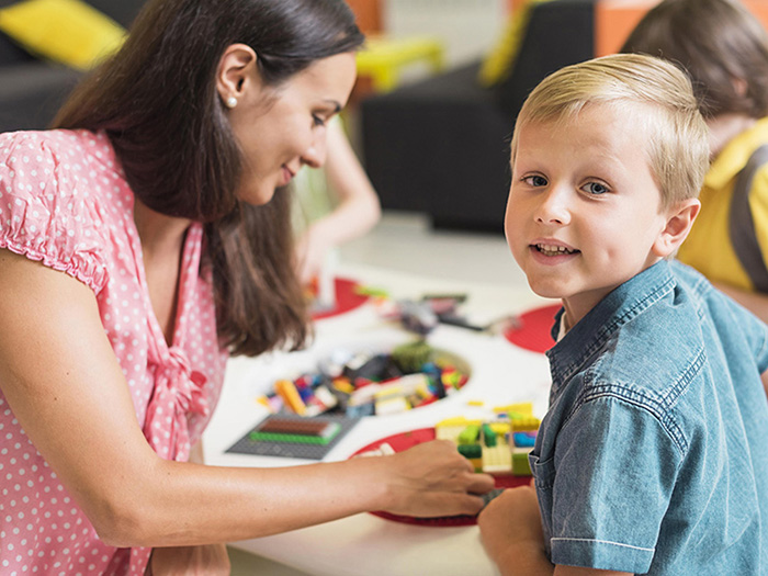 teacher-playing-with-kindergarten-kid.jpg